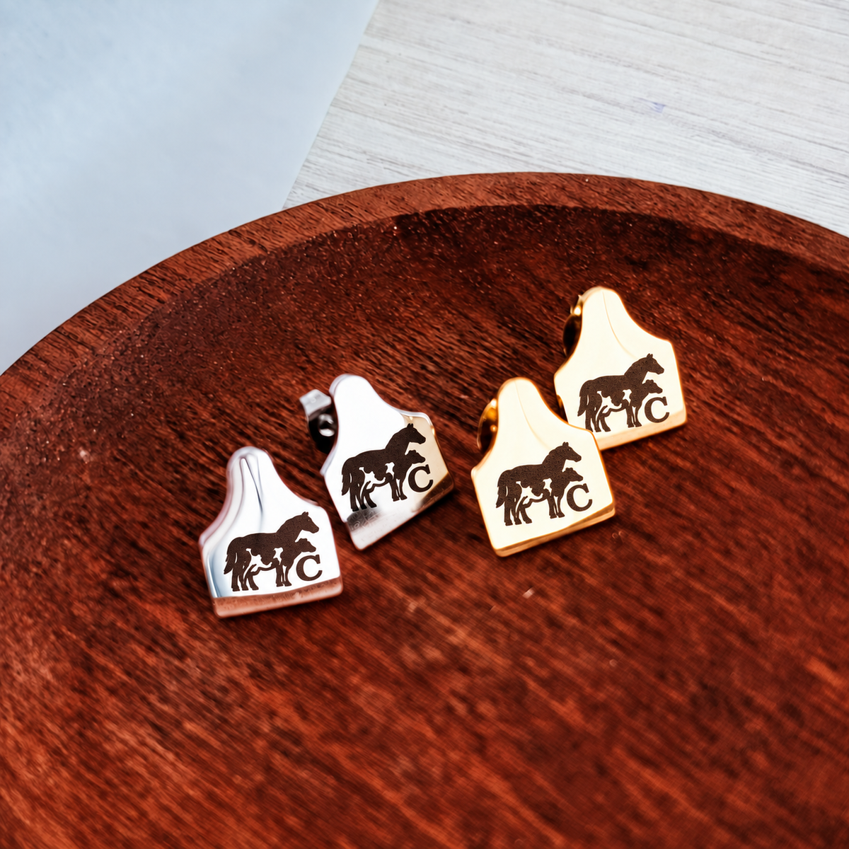 Cow tag stud earrings engraved with matching cow and calf artwork